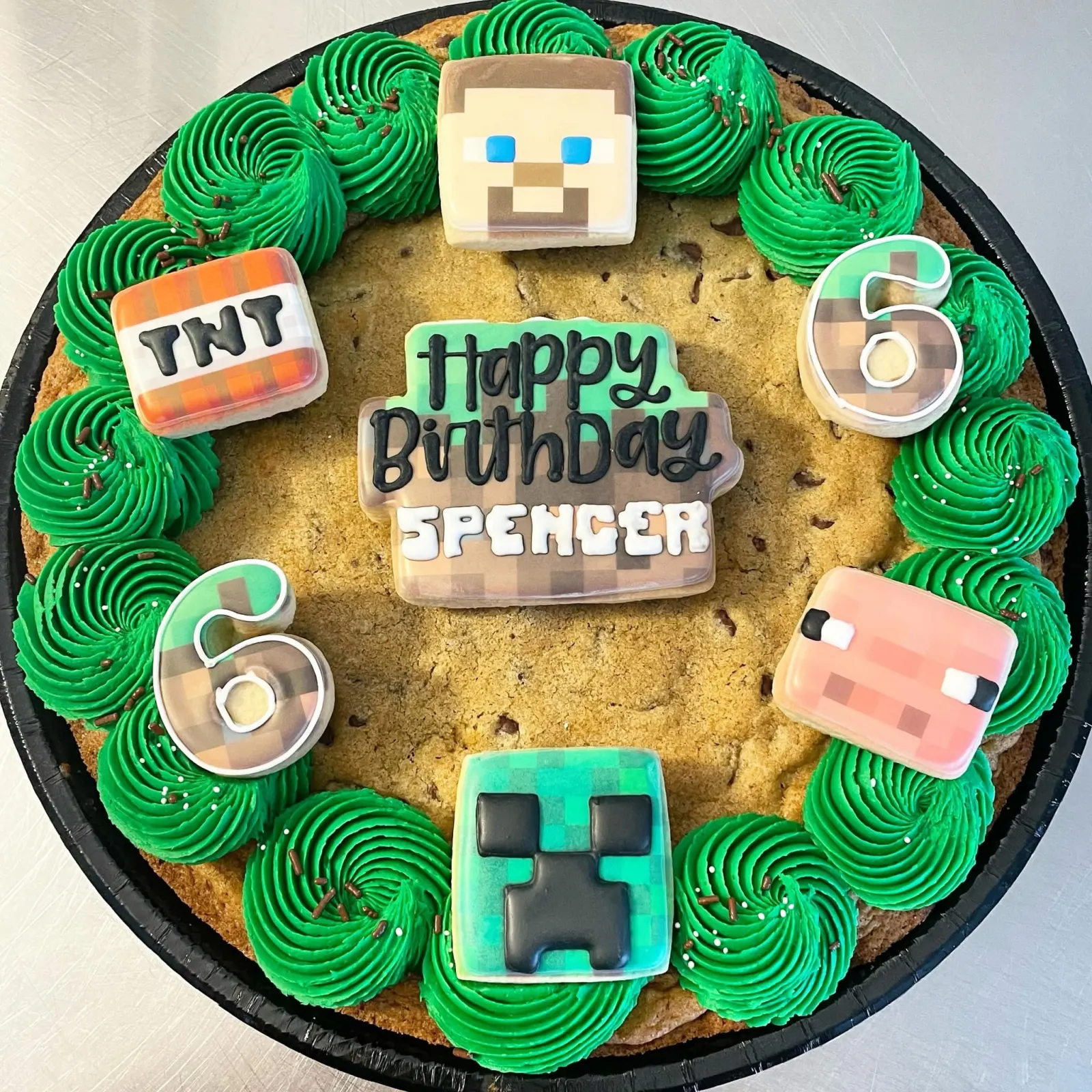 Minecraft themed cookie cake with bright green frosting