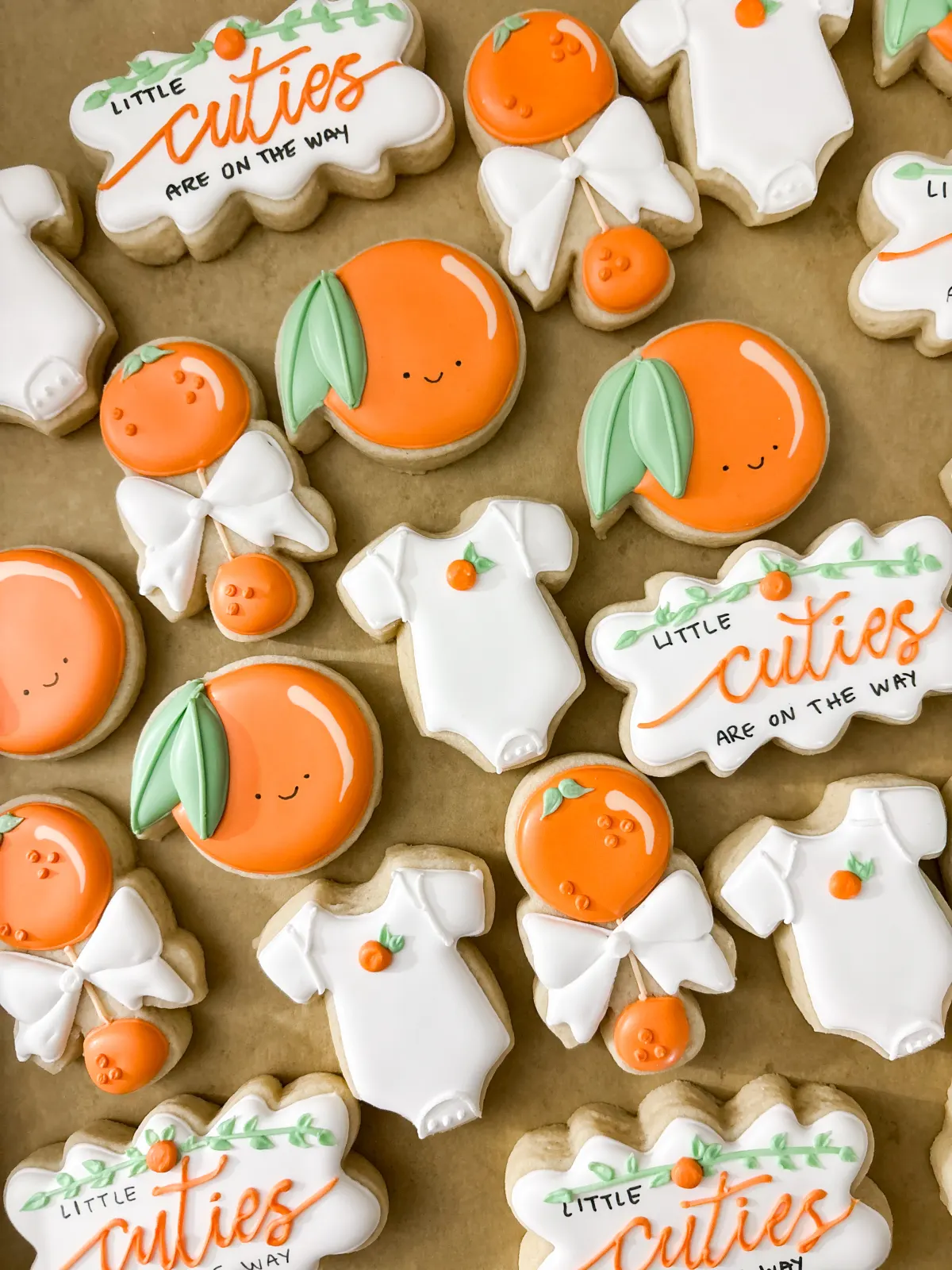 Little Cuties themed mini cookies with oranges and bows