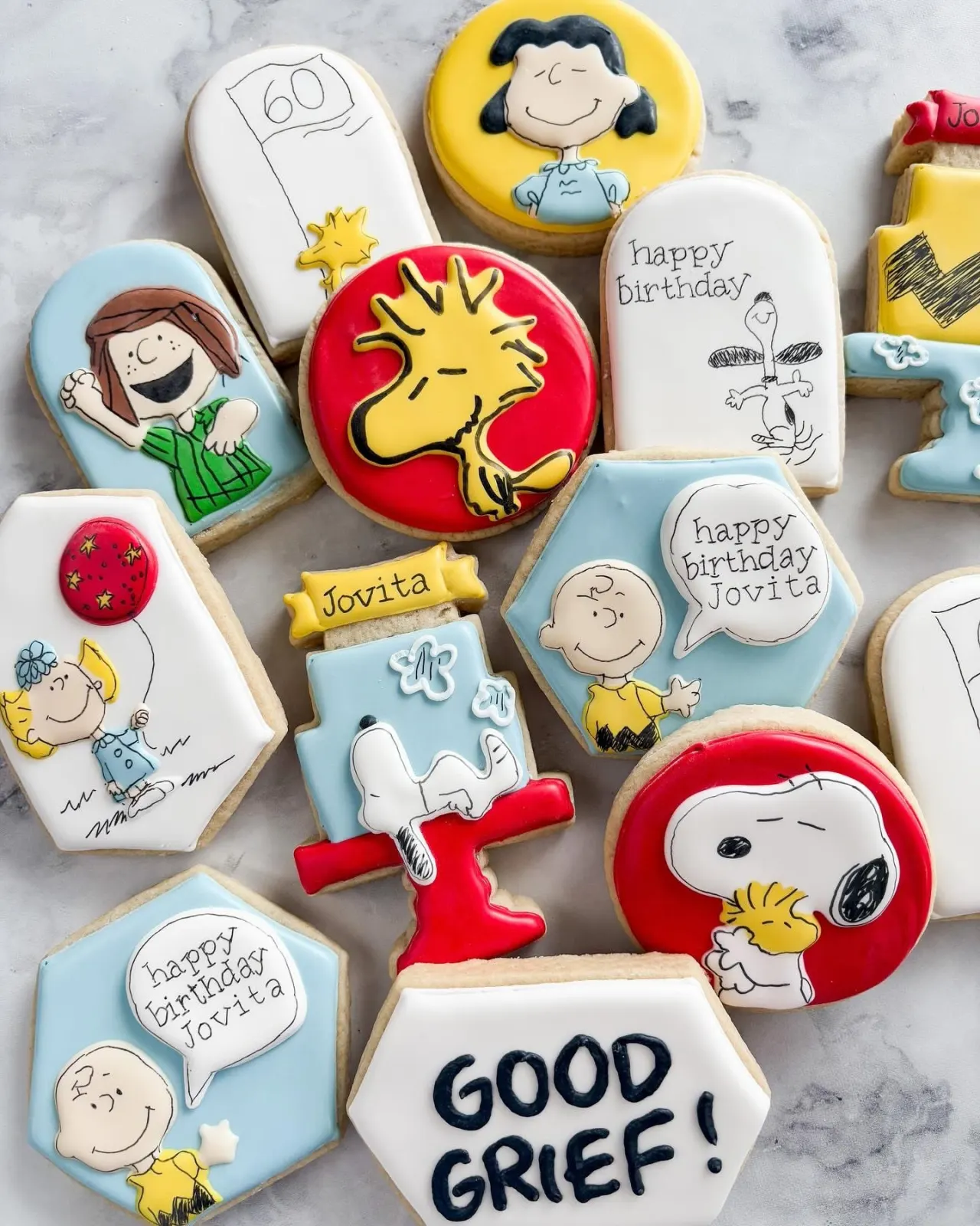 Peanuts themed decorated cookies with Snoopy and Woodstock